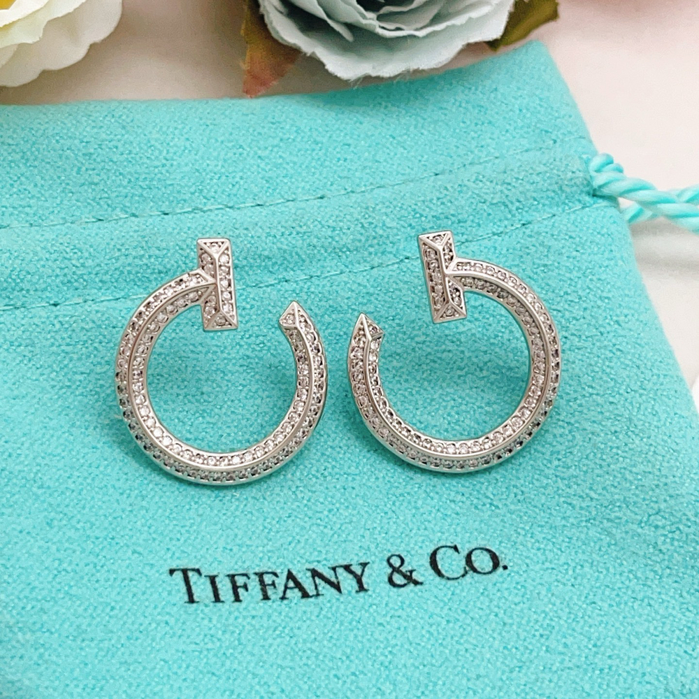 Tiffany & Co. Silver diamond-encrusted smiley face earrings